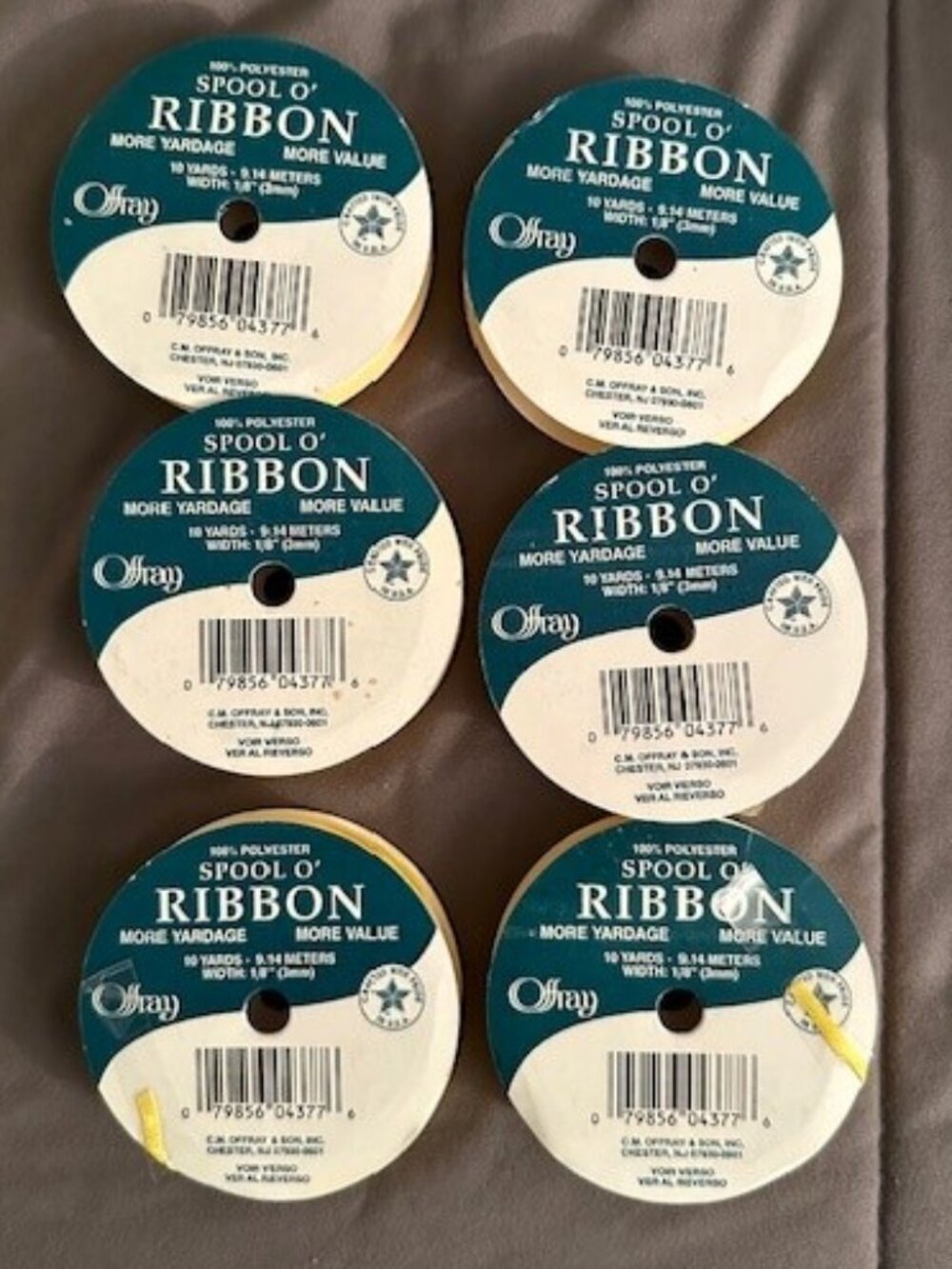 9 spools of yellow ribbon